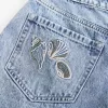 High-Rise Medium Wash Shell Embroidered Baggy Denim Shorts 5″ High-Rise Medium Wash Shell Embroidered Baggy Denim Shorts 5″