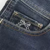 Low-Rise Dark Wash Embroidered Denim Shortie Shorts