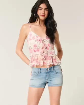 Low-Rise Medium Wash Studded Denim Shortie Shorts