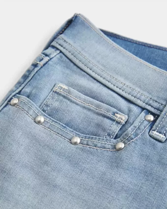 Low-Rise Medium Wash Studded Denim Shortie Shorts